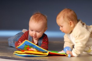 bigstockphoto_babies_playing_with_toys_2666254_92r7